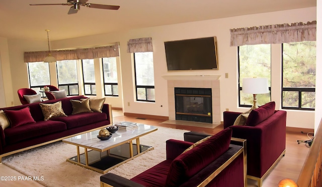 918 Marcus Dr, Prescott, AZ 86303 - living area with ceiling fan, a fireplace, wood finished floors, and baseboards