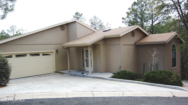 view of front of home featuring a garage and driveway