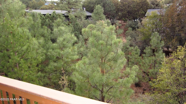 birds eye view of property with a view of trees