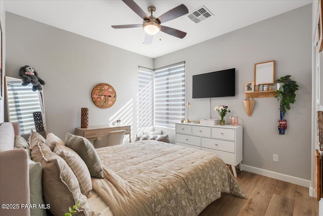 bedroom featuring ceiling fan and light hardwood / wood-style flooring