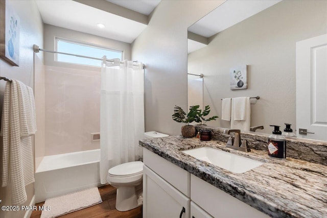 full bathroom featuring toilet, vanity, wood-type flooring, and shower / tub combo with curtain