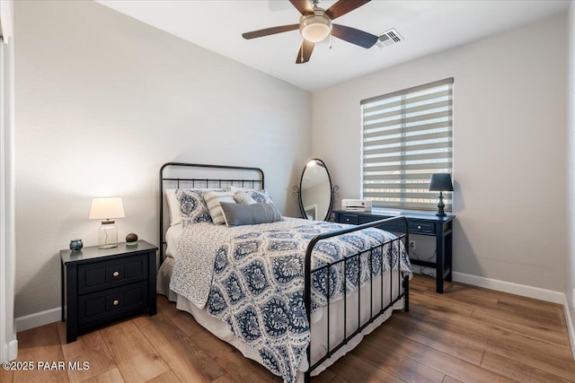 bedroom featuring ceiling fan and hardwood / wood-style flooring