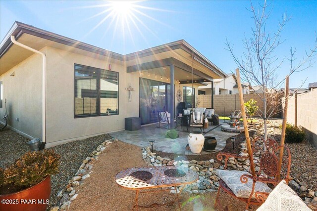 rear view of house featuring a patio area