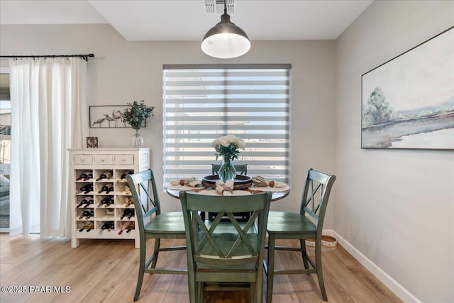 dining area featuring wood-type flooring