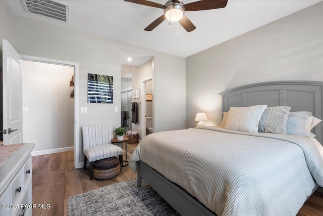 bedroom with ceiling fan and hardwood / wood-style floors