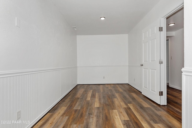 empty room with dark hardwood / wood-style floors