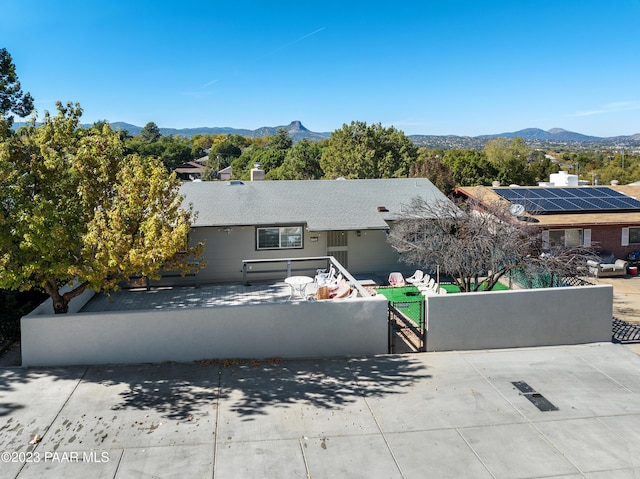 view of front of home featuring a mountain view