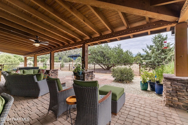 view of patio with outdoor lounge area and ceiling fan