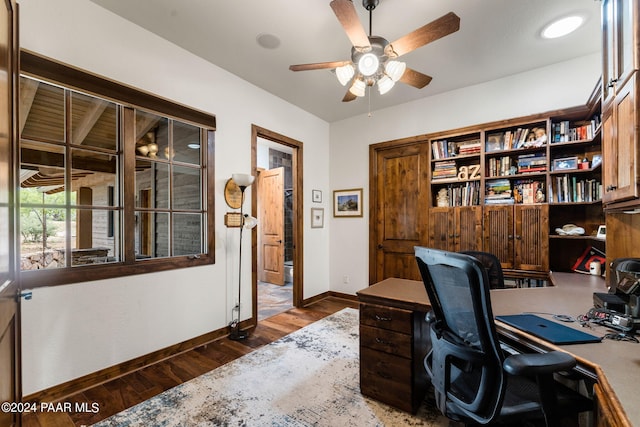 office area featuring ceiling fan and dark wood-type flooring