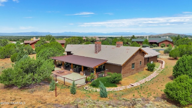 birds eye view of property featuring a mountain view