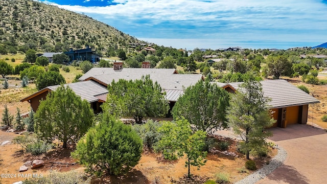 birds eye view of property with a mountain view