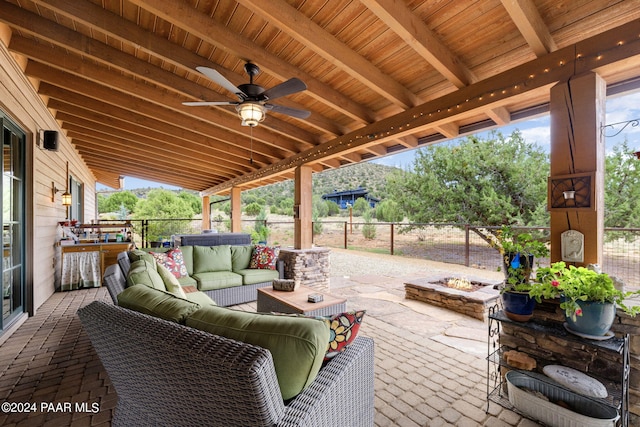 view of patio featuring an outdoor living space and ceiling fan