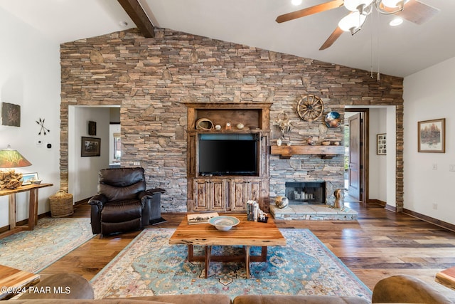 living room featuring ceiling fan, beam ceiling, wood-type flooring, and a fireplace