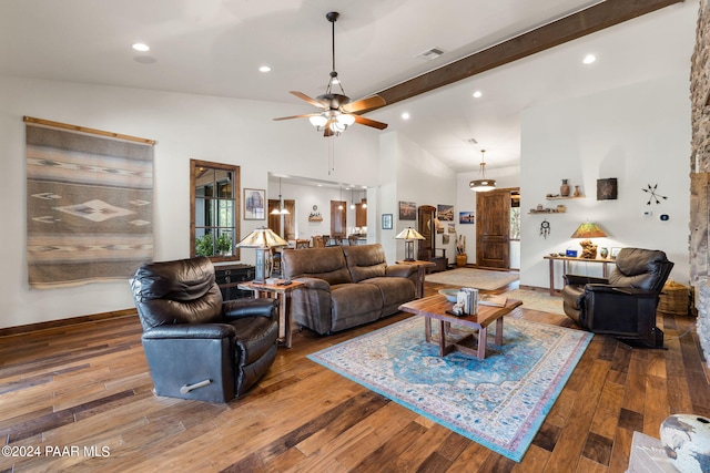 living room with hardwood / wood-style flooring, ceiling fan, beamed ceiling, and high vaulted ceiling