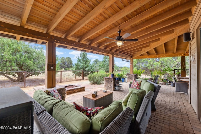 view of patio with an outdoor living space and ceiling fan