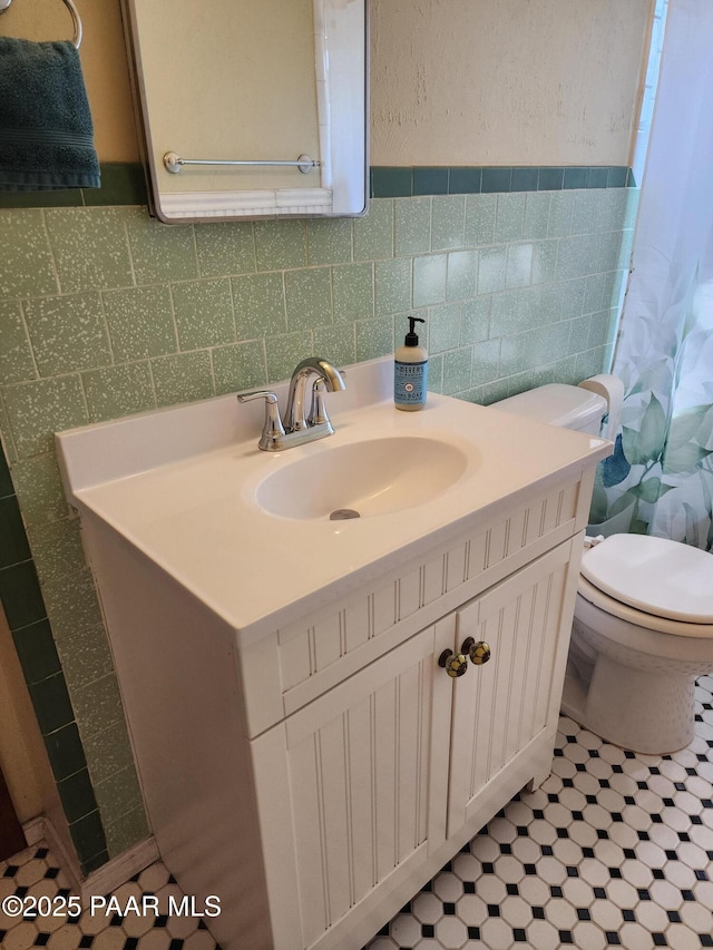 1024 W Copper Basin Rd, Prescott, AZ 86303 - bathroom featuring vanity, tile walls, tile patterned floors, and a shower with shower curtain