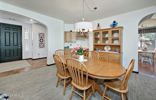 dining area featuring a chandelier