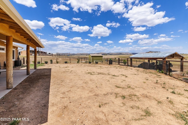 26455 N Bull Snake Rd, Paulden, AZ 86314 - view of yard with exterior structure, an outbuilding, a rural view, and a mountain view