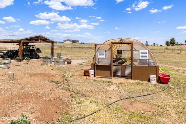 26455 N Bull Snake Rd, Paulden, AZ 86314 - view of yard featuring a greenhouse, an outbuilding, and a view of countryside