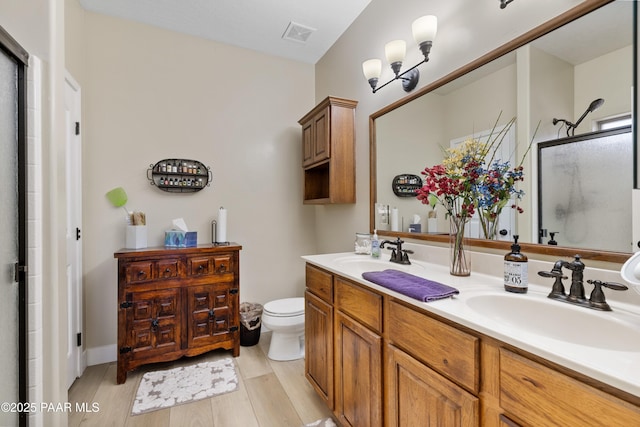 26455 N Bull Snake Rd, Paulden, AZ 86314 - full bathroom with a shower with door, double vanity, and wood finished floors