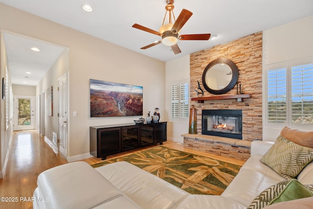 1671 W Catim Way, Prescott, AZ 86305 - living room featuring a ceiling fan, wood finished floors, a stone fireplace, and recessed lighting