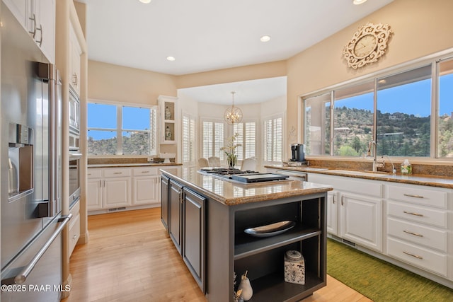 1671 W Catim Way, Prescott, AZ 86305 - kitchen featuring appliances with stainless steel finishes, open shelves, white cabinetry, recessed lighting, and light stone countertops