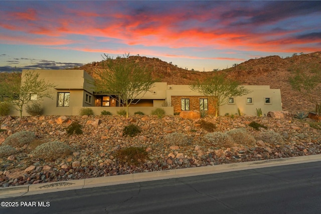 view of front of home featuring a mountain view