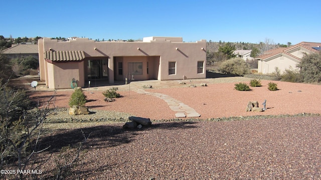 back of house featuring a patio