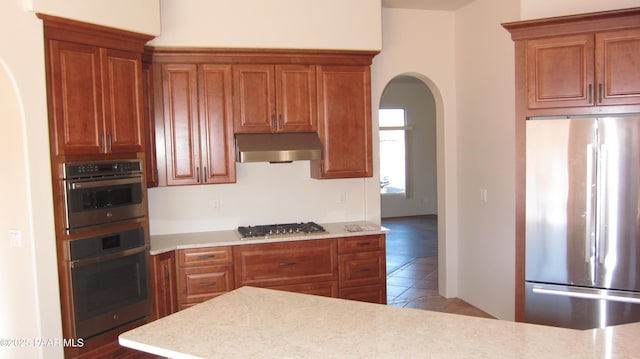 kitchen with appliances with stainless steel finishes and tile patterned floors