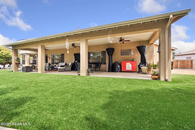 5570 N Pierce Ln, Prescott Valley, AZ 86314 - back of property with a ceiling fan, an outdoor living space, a patio, and stucco siding