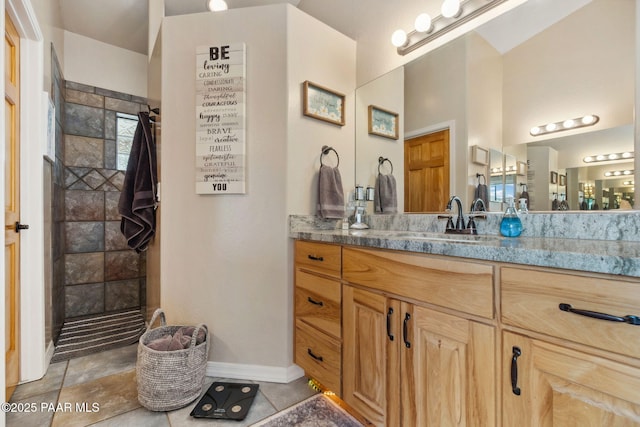 5570 N Pierce Ln, Prescott Valley, AZ 86314 - bathroom with vanity, a walk in shower, tile patterned floors, and baseboards