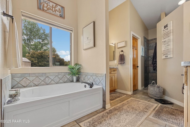 5570 N Pierce Ln, Prescott Valley, AZ 86314 - full bathroom with vanity, a garden tub, tile patterned flooring, and a tile shower