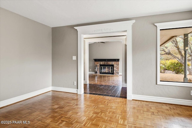 1141 Deerfield Rd, Prescott, AZ 86303 - empty room featuring baseboards and a brick fireplace