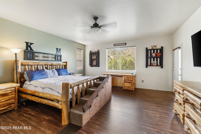 bedroom with ceiling fan and dark wood-type flooring