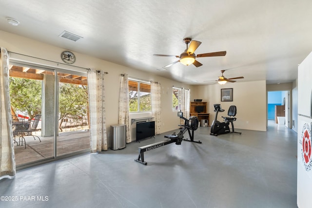workout room featuring visible vents and a ceiling fan