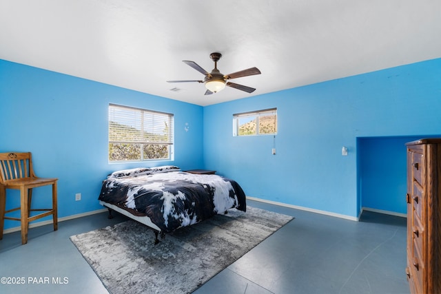 bedroom featuring baseboards, ceiling fan, and visible vents
