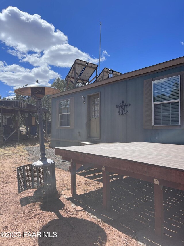 54683 N El Portal Ln, Seligman, AZ 86337 - rear view of house with a wooden deck