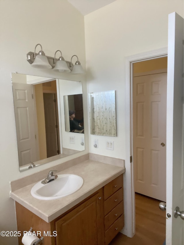 54683 N El Portal Ln, Seligman, AZ 86337 - bathroom featuring wood finished floors and vanity
