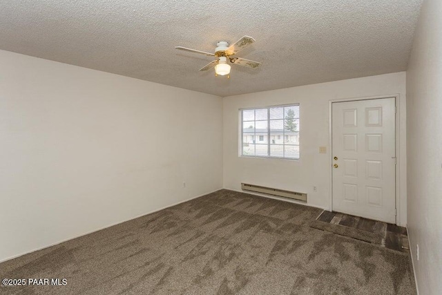 entrance foyer with a baseboard heating unit, a textured ceiling, dark colored carpet, and ceiling fan