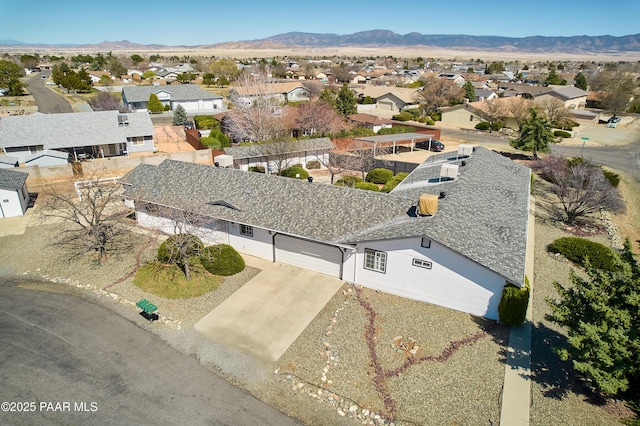 bird's eye view featuring a mountain view and a residential view