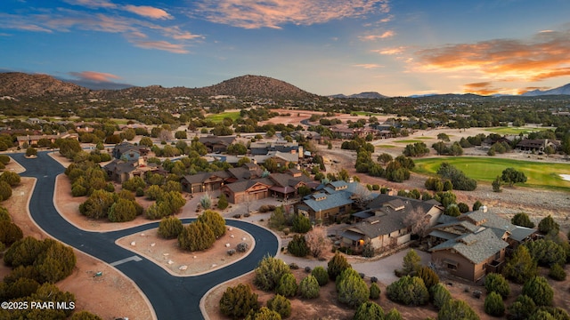 drone / aerial view featuring a residential view and a mountain view