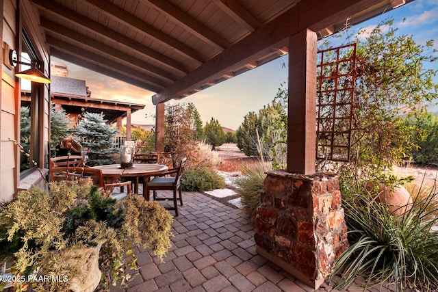 patio terrace at dusk with outdoor dining space