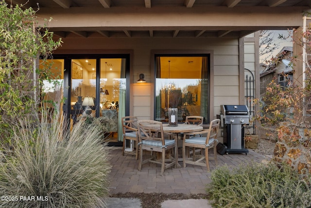 view of patio / terrace with outdoor dining area and a grill