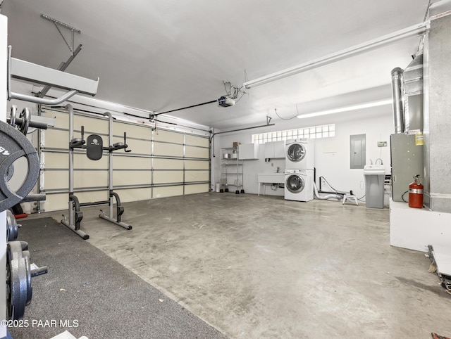 22891 S Lakewood Dr, Yarnell, AZ 85362 - garage featuring a garage door opener, a sink, stacked washing maching and dryer, and electric panel