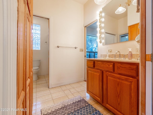 22891 S Lakewood Dr, Yarnell, AZ 85362 - bathroom featuring vanity, tile patterned floors, baseboards, and toilet