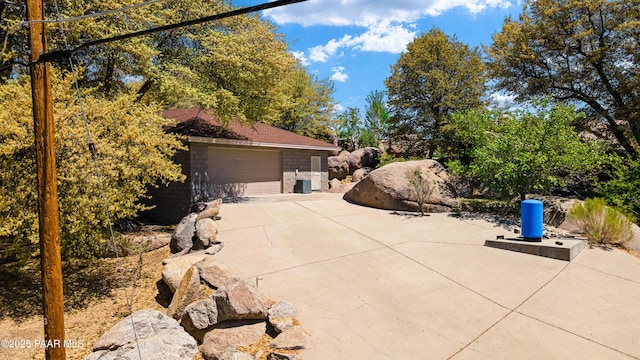 22891 S Lakewood Dr, Yarnell, AZ 85362 - view of home's exterior with a garage and stone siding