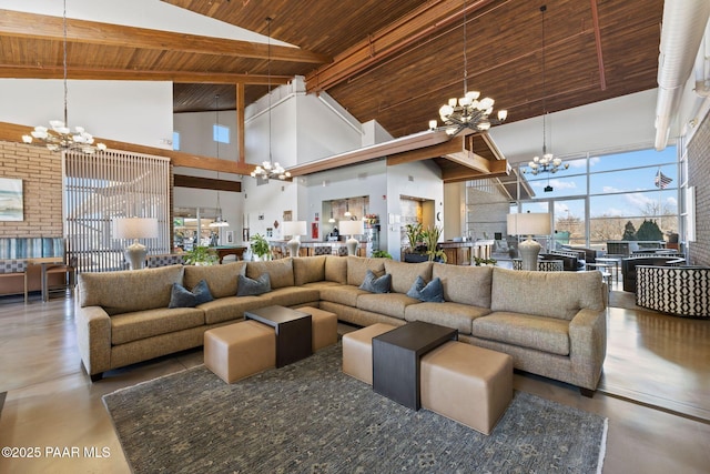 living area with a notable chandelier, wood ceiling, and concrete flooring