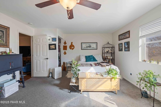 carpeted bedroom featuring a ceiling fan