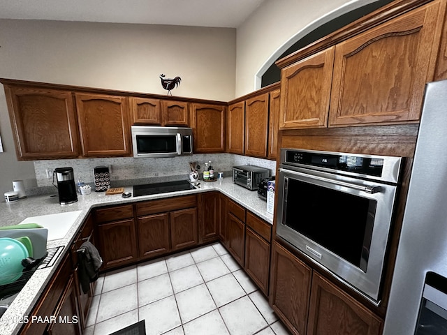 4433 N La Jolla Cir, Prescott Valley, AZ 86314 - kitchen featuring stainless steel appliances, light countertops, and light tile patterned floors