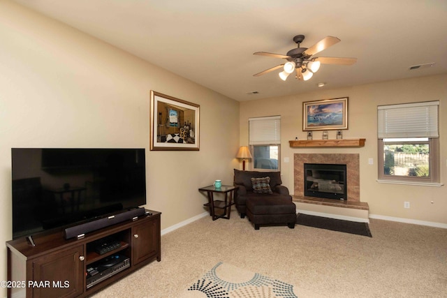 12933 Ponce St, Dewey-Humboldt, AZ 86327 - living area featuring a ceiling fan, light carpet, and a fireplace